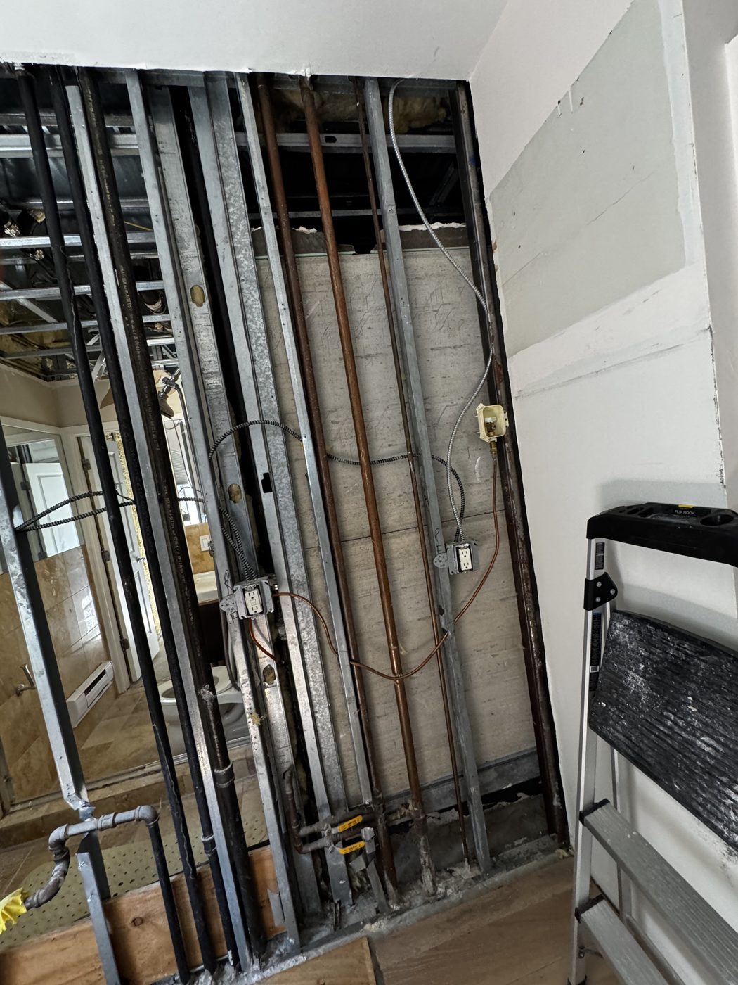 Open wall framing and rough-in work by Art-Tech Construction Corp